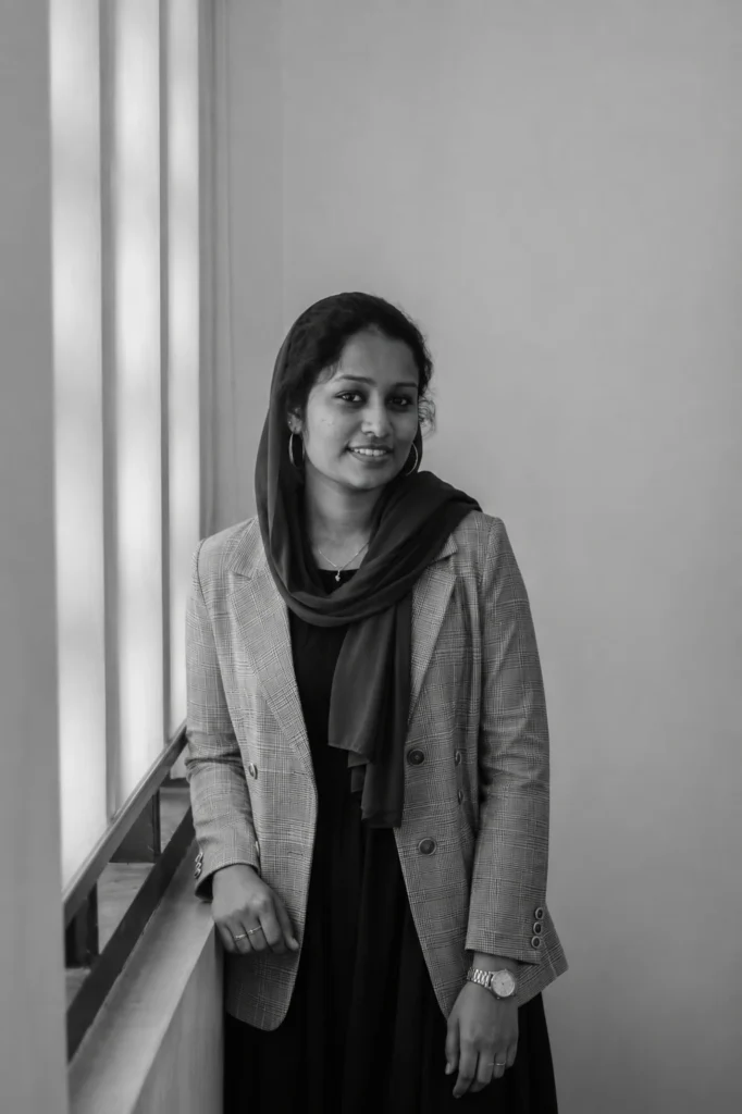 Freelance SEO Analyst in Ernakulam- professional portrait of Thayyiba standing by the window